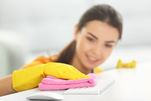Cleaner reviewing booking details for a UK cleaning service