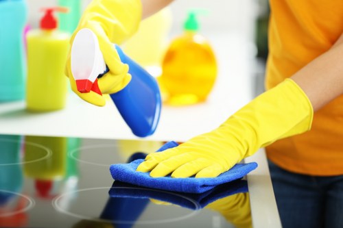 Staff following protective measures while handling cleaning equipment
